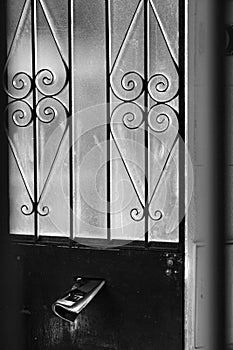 Old glass and wrought iron entrance door