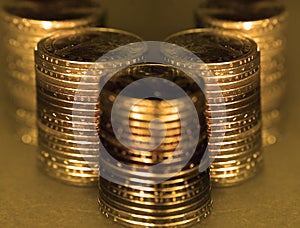 Old Gold Coins in Stacks and Piles for Cash Money Representing Wealth and Riches