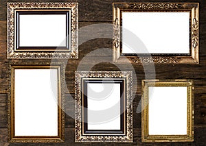 Old Gold Picture Frames on wooden wall