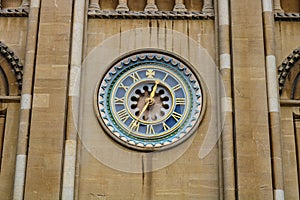 Old gold set clock on front of norwich cathedral east anglia england