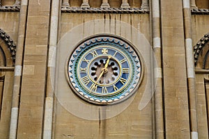 Old gold set clock on front of norwich cathedral east anglia england photo