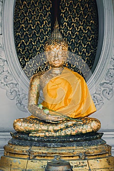 Old golden Buddha image in Thailand temple.