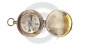 An old golden compass with the compass arrow spinning wildly. Concept of lost direction, or searching for a path or adventure