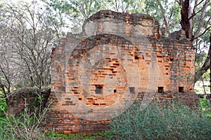Old goldfields abandoned ruins in Australian bush land photo