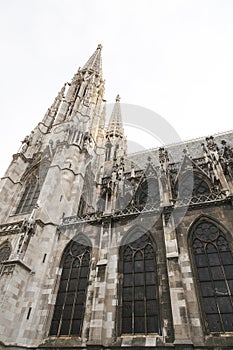 Neogothic church tower of Votivkirche church in Vienna photo