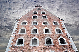 Old gothic house in Torun, dark sky