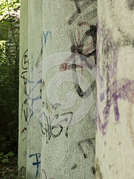 Old, graffitied columns in a row