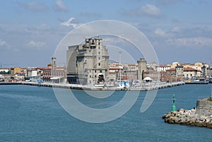 The old grain silos and the old fortress in the Port of Livorno, Italy