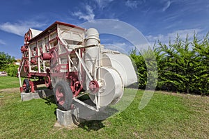 An old grain thresher used as a monument