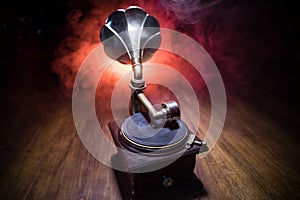 Old gramophone on a dark background. Music concept photo
