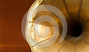 Old gramophone horn detail on wooden background