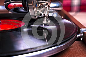 Old gramophone player, closeup. Retro styled image of a collection of old vinyl record lp`s with sleeves.