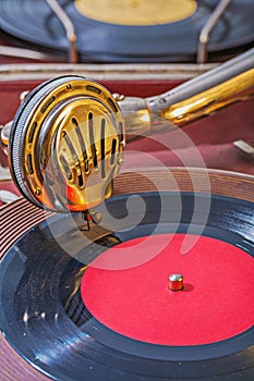 Old gramophone view on speaker on vinil disk photo