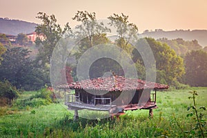 Old granary, typical Asturian granary for storage and drying of photo