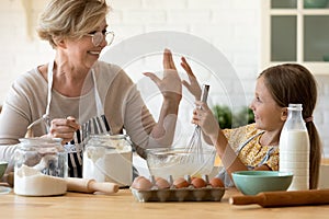 Old grandma give high five to grandkid praise for result