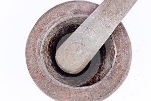 Old granite stone mortar and pestle are Thai cooking tool on white background food isolated top view