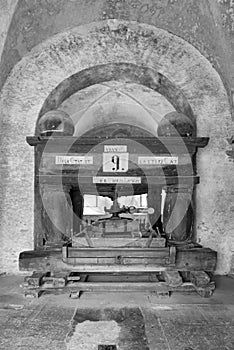 Old grape press in the eberbach monastery near eltville germany in black and white photo