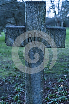 Old grave RIP Rest in peace crucifix on a cemetery