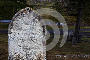 Old gravestone with  Father on it