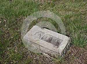 Old gravestone with  Father on it