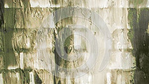 An old, gray brick wall. Light background, brick texture