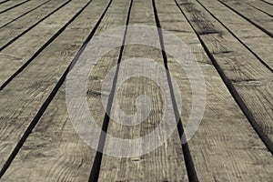 Old gray floorboards with gaps, closeup, background, texture