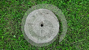 Old gray millstone