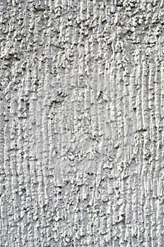 Old gray plaster on wall closeup