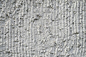 Old gray plaster on wall closeup