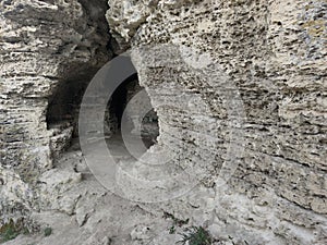 The old gray rock wall. Layered sea shell rock stone. The round cave .. Tsypovo. Moldova