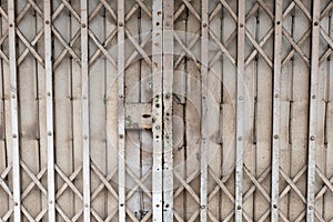 Old gray rusty antique slide steel door