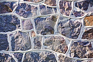 Old gray stone wall rustic texture background.