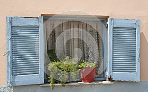 Old Greek Blue Window Shutters with pretty curtains