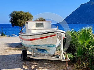 Old Greek fishing boat pulled ashore