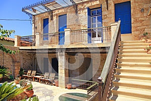 Old Greek house with blue doors and windows, Crete