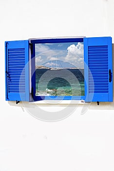 Old Greek traditional house with blue window in Santorini