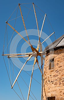 Old Greek windmill against blue sky. Patmos Island, Greece