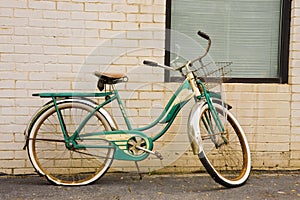 Old Green Bike on Brick Wall