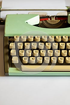 An old green mechanical typewriter
