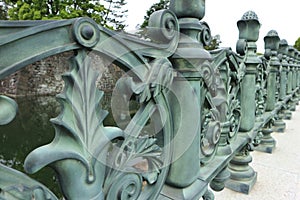 Old green metal fence around the palace