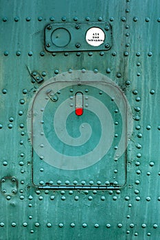 Old green painted aircraft hatch.