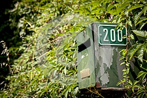 Old green postbox with number 200