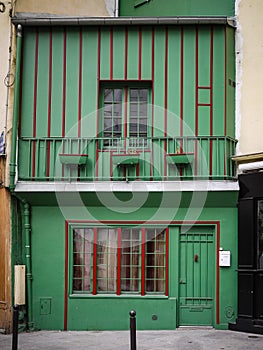 Old green and red building in Paris, France