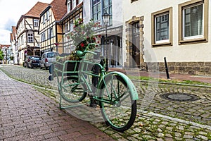 Old green retro bicycle in Hamelin, Germany