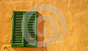 Old, green shutters in Florence, Italy