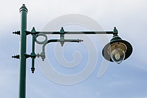 An old green streetlamp in a rural