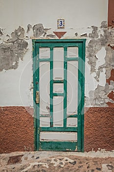 Old green and white wooden doors