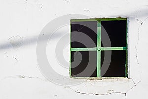 Old Green Window on Cracked Wall