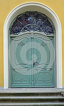 Old green wooden baroque doors