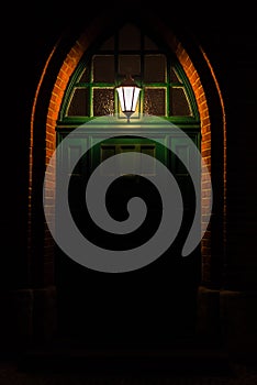 Old green wooden door with a single light